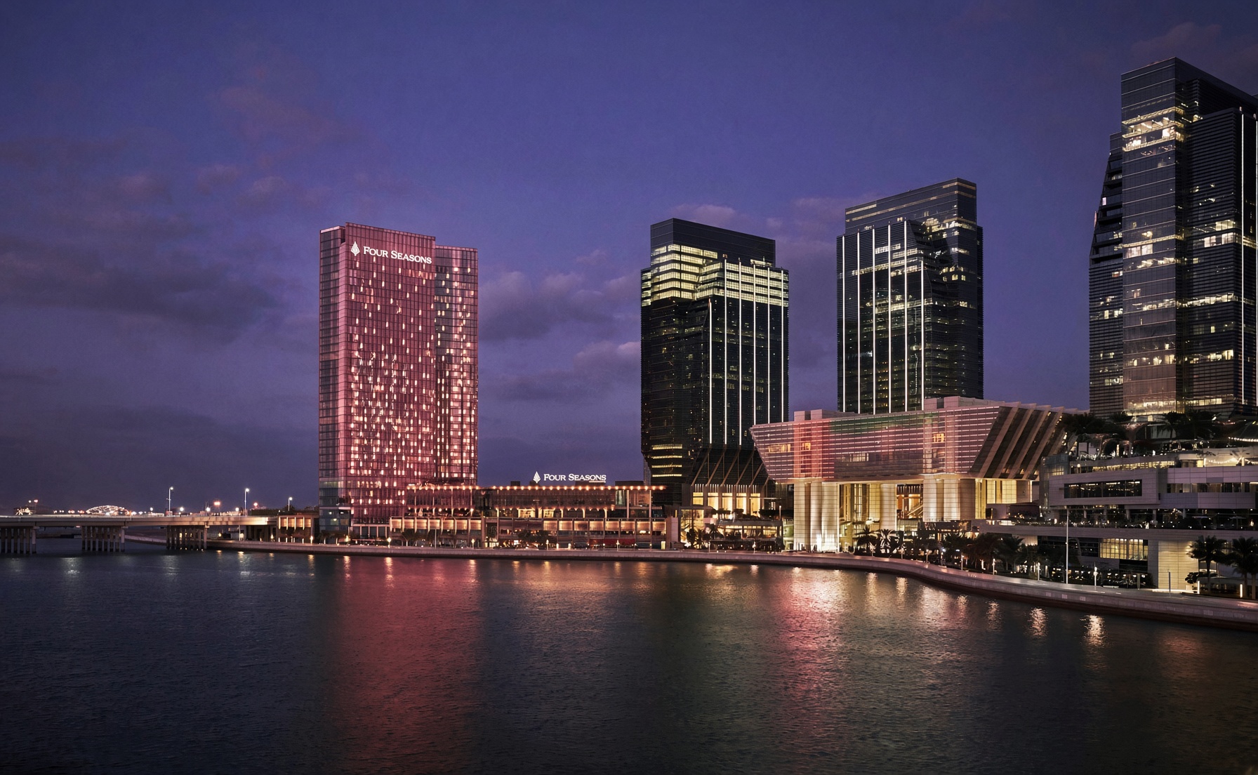 Four Seasons Hotel Abu Dhabi at Al Maryah Island illuminated at night — venue of the Pink Ribbon Foundation UAE launch