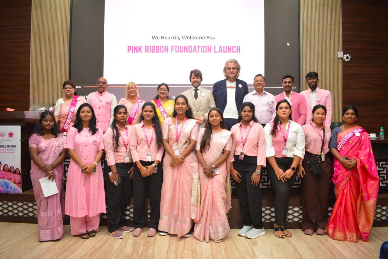 Group of Pink Ribbon Foundation India launch attendees in pink on stage, Constitution Club of India, New Delhi